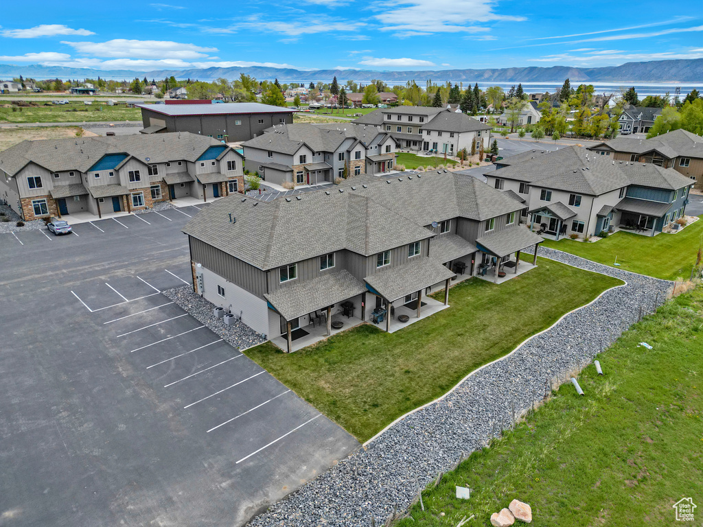 Aerial perspective of suburban area with a mountain backdrop
