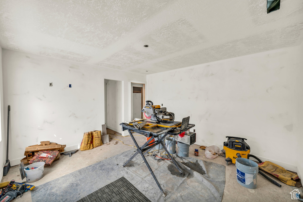Misc room with a textured ceiling