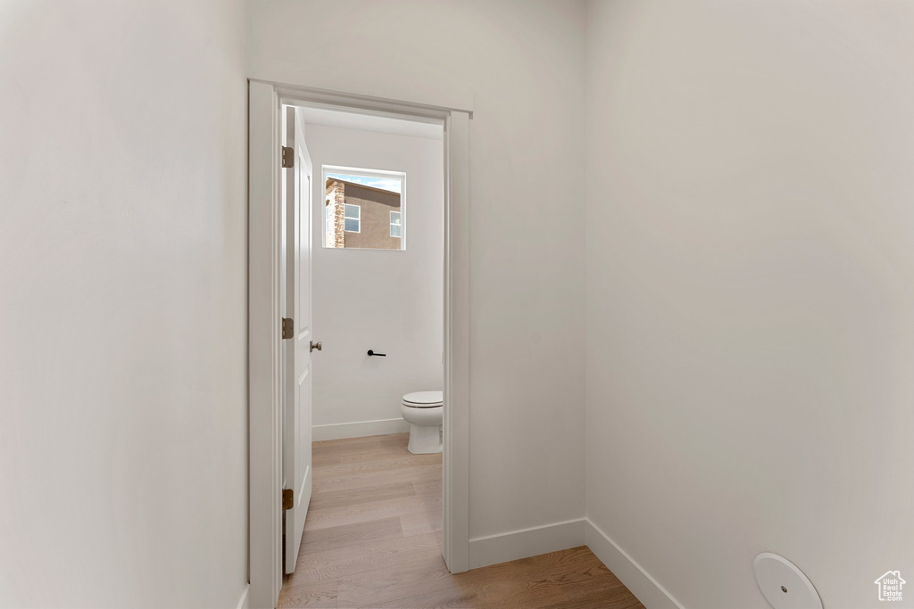 Bathroom featuring toilet and wood finished floors