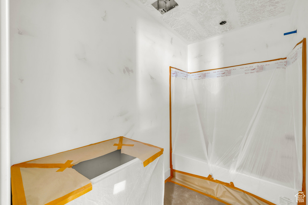 Bathroom with a textured ceiling
