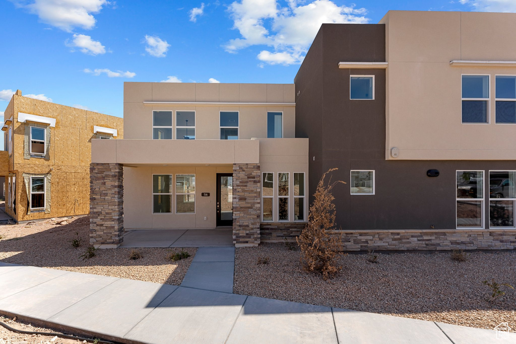 Contemporary house with stucco siding and stone siding