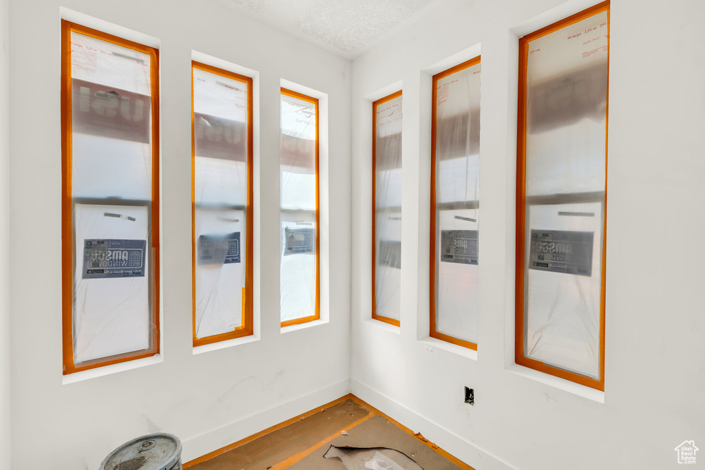 Spare room featuring baseboards