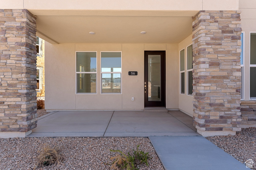 Doorway to property with stucco siding