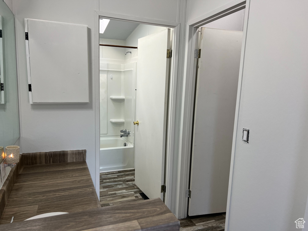 Corridor featuring wood finished floors