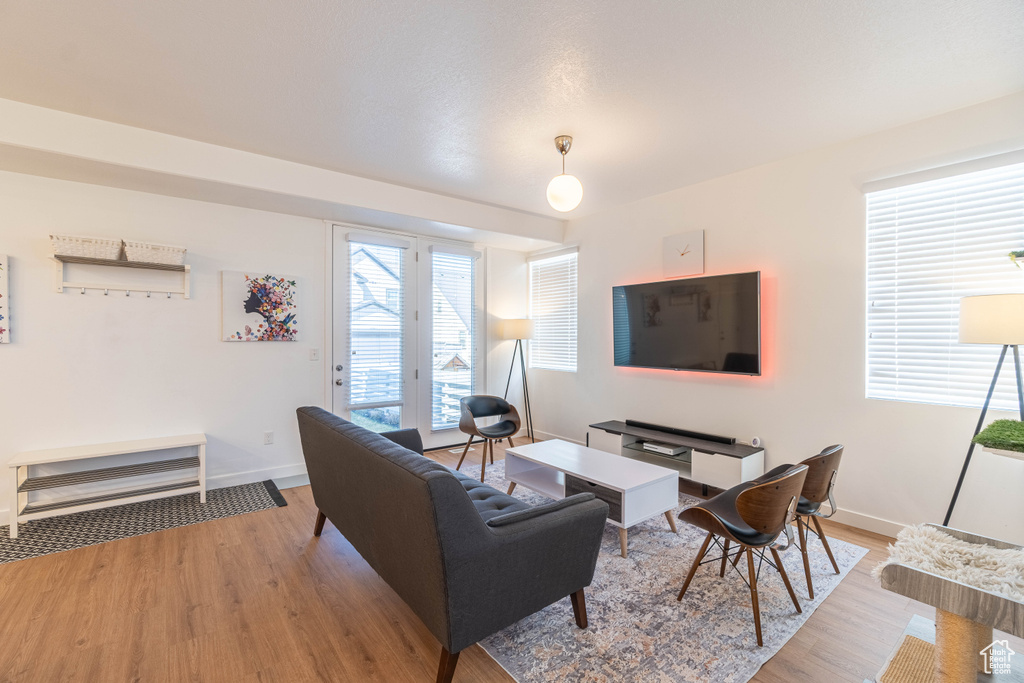 Living area featuring light wood finished floors and baseboards