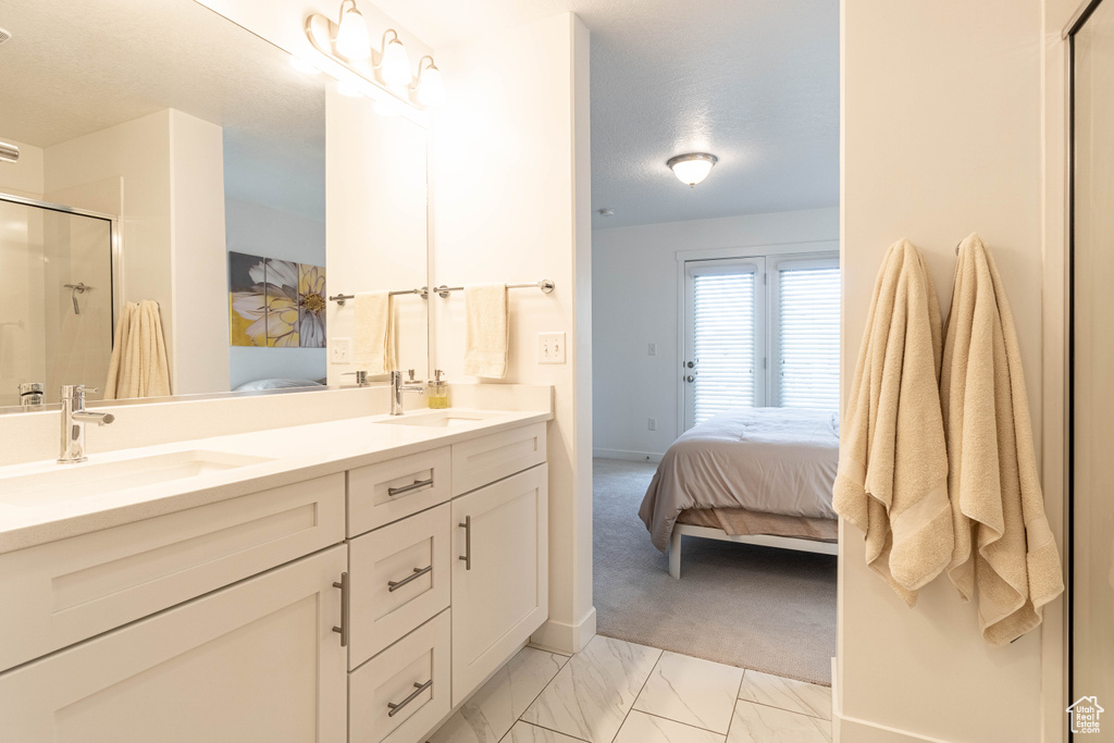 Ensuite bathroom with a sink, a shower stall, and ensuite bath