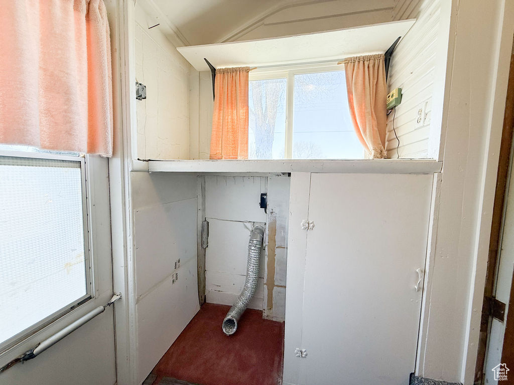 Washroom featuring plenty of natural light and laundry area