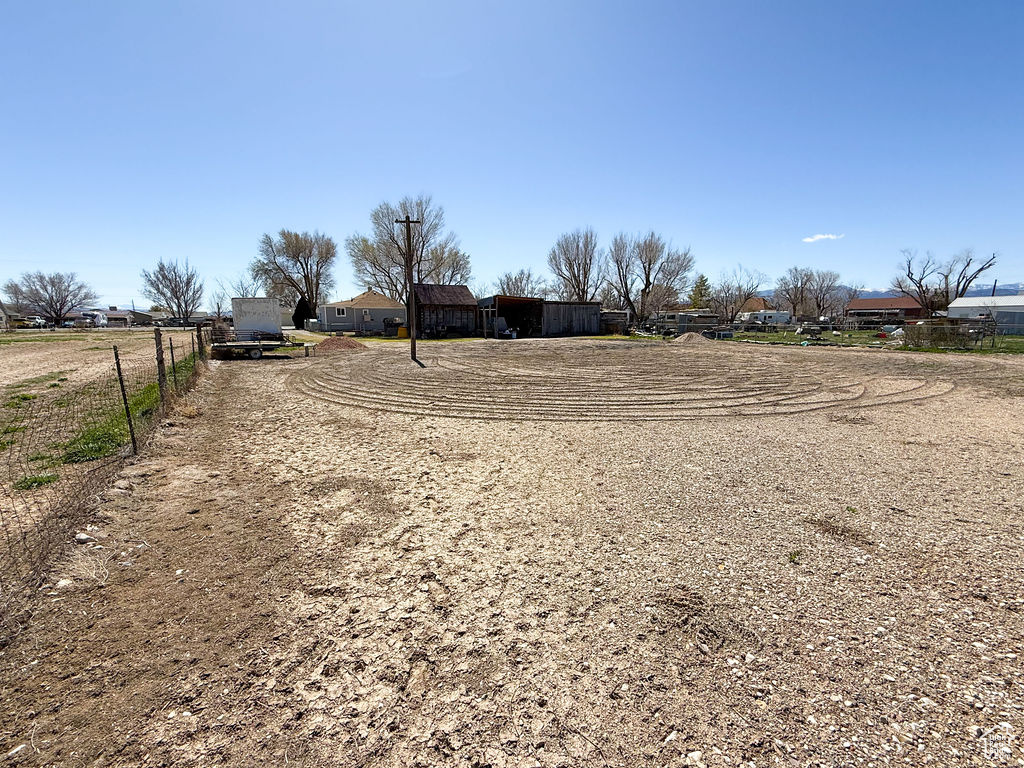 View of yard with fence and driveway