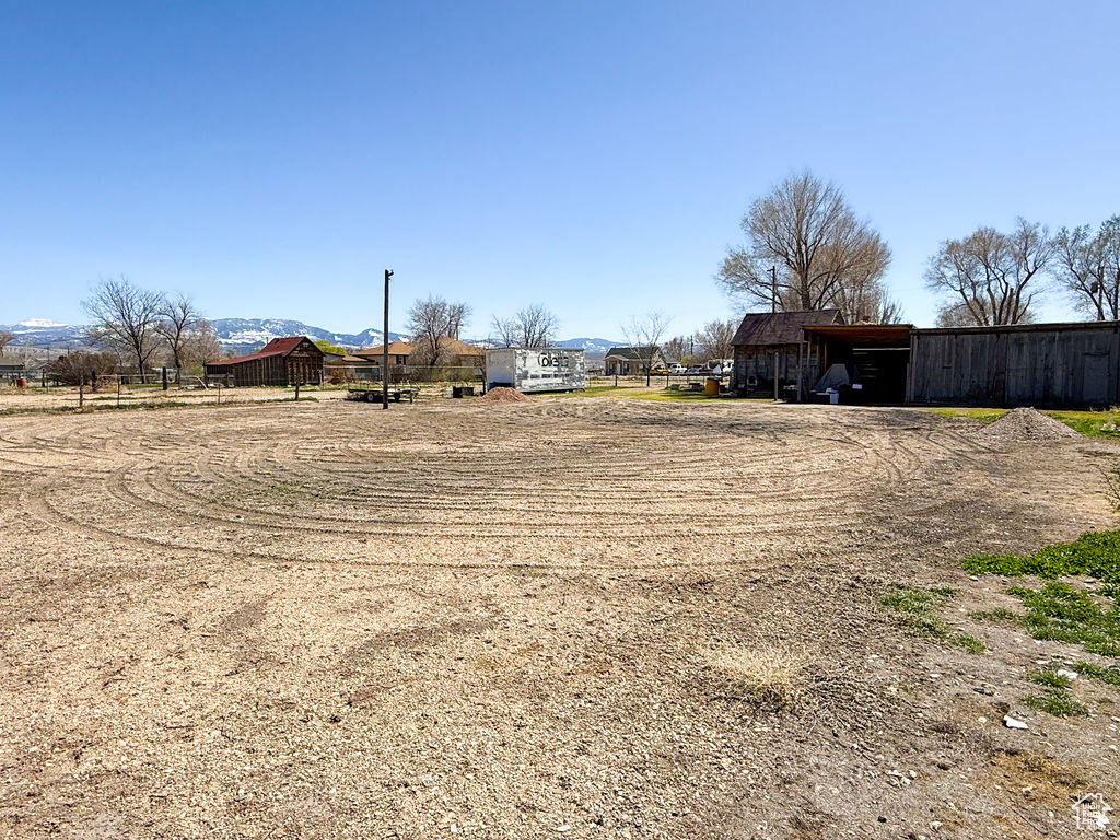 View of yard featuring an outbuilding and a pole building