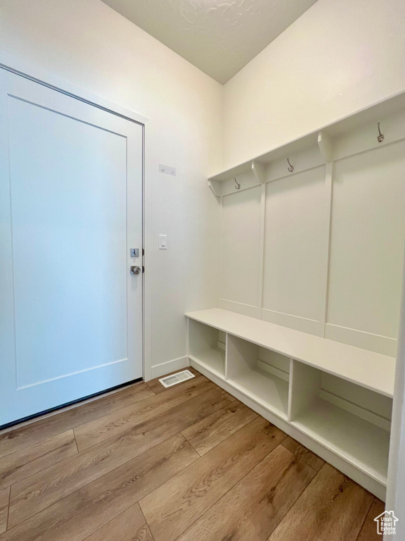 Mudroom featuring wood finished floors