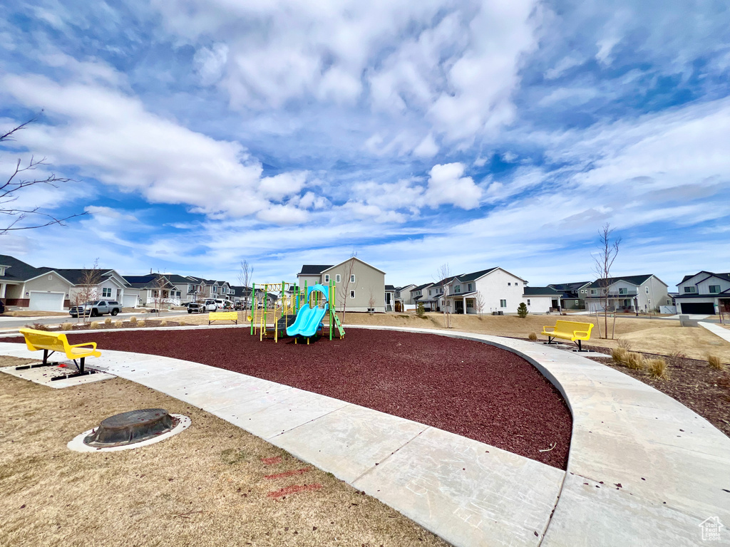 Communal playground featuring a residential view and a fire pit