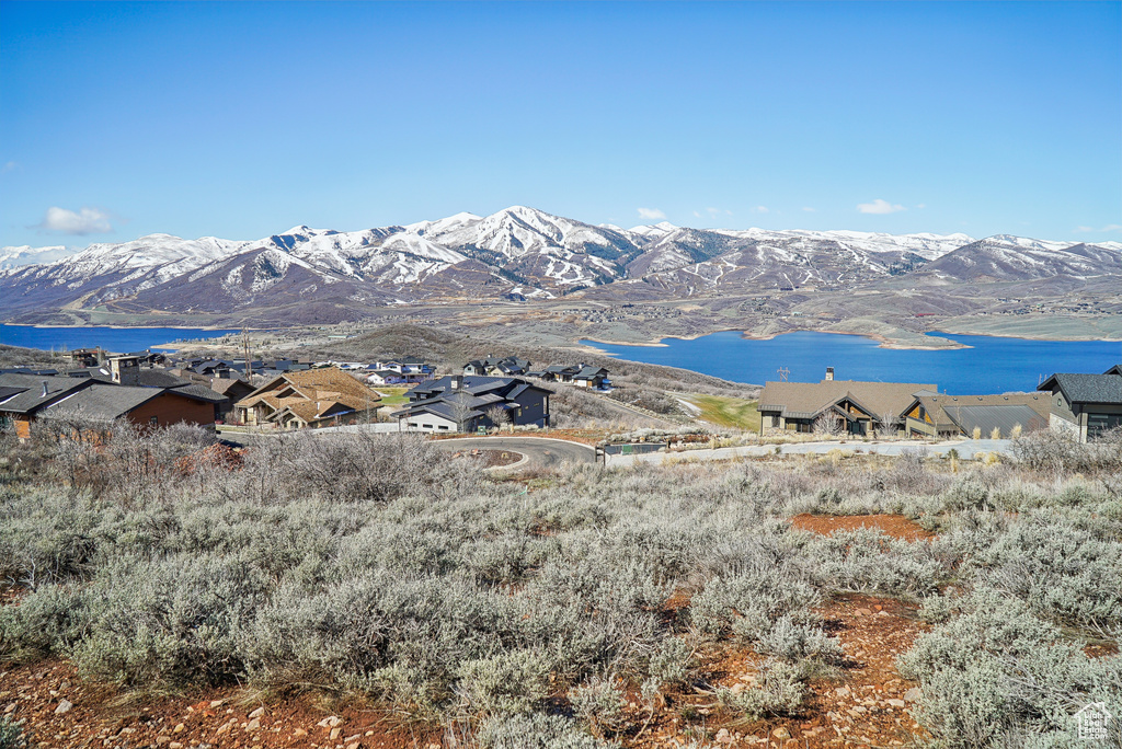 Property view of mountains featuring a water view
