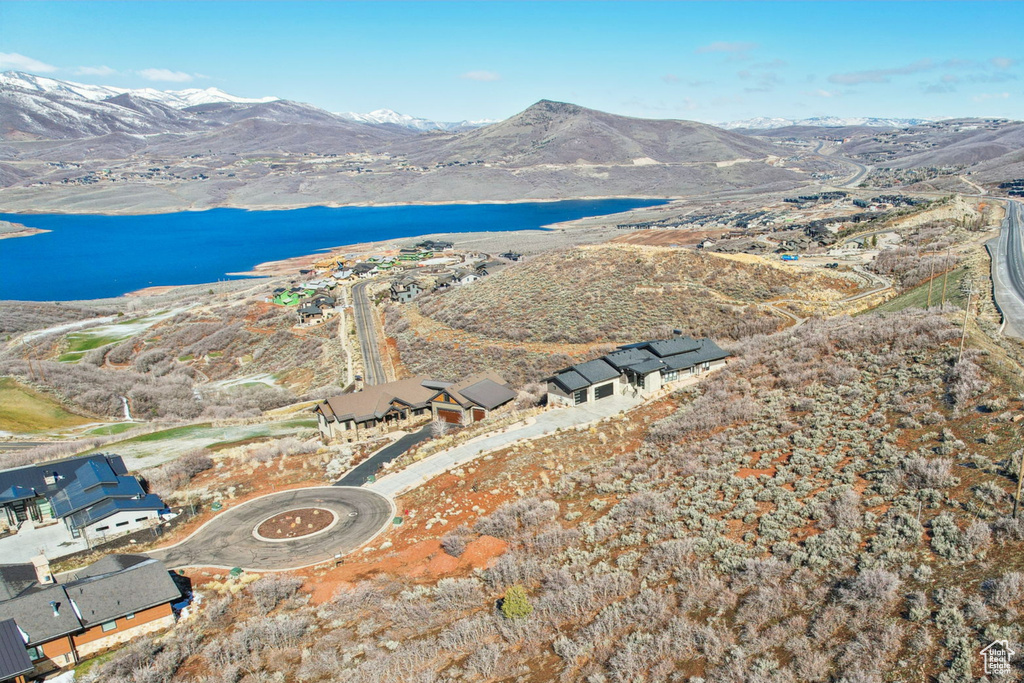 Aerial view featuring a water and mountain view