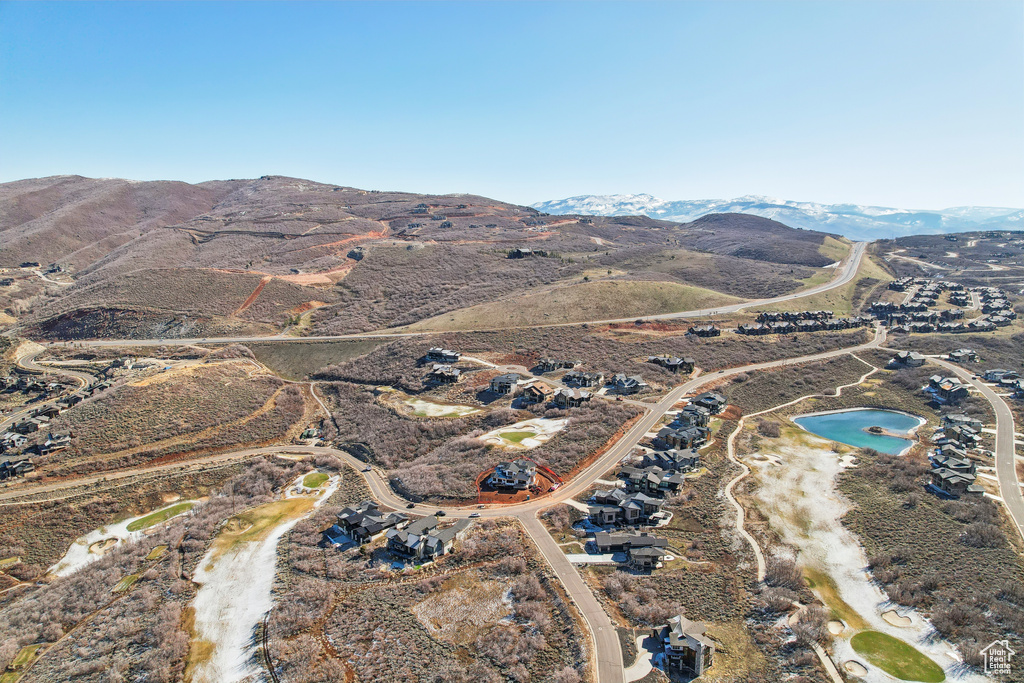 Birds eye view of property with a mountain view