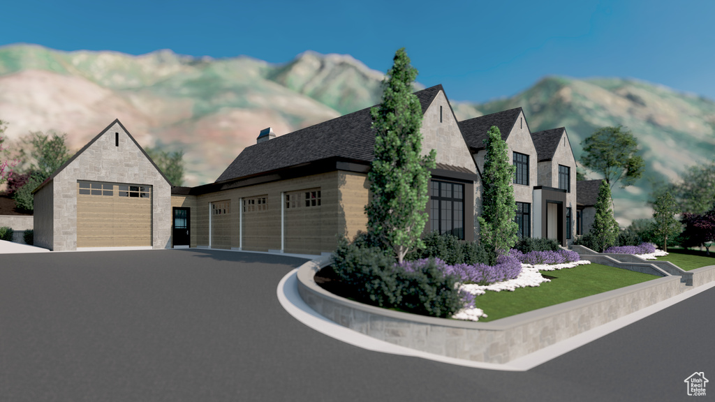 View of side of home featuring a garage and stone siding