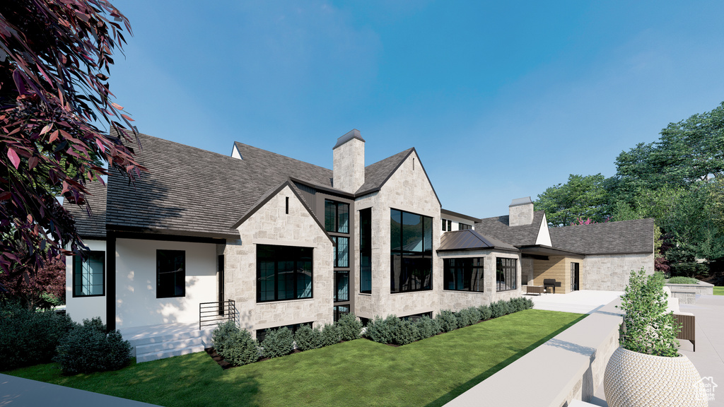 View of front of house with a chimney, stucco siding, stone siding, and a front lawn