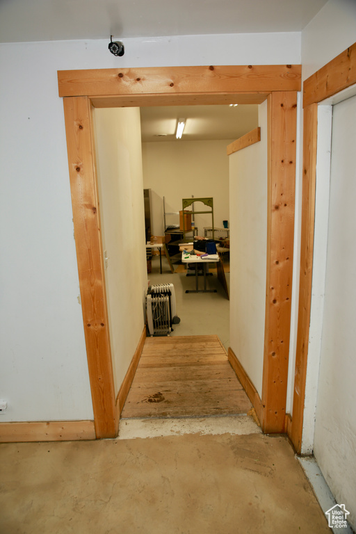 Hall featuring concrete flooring