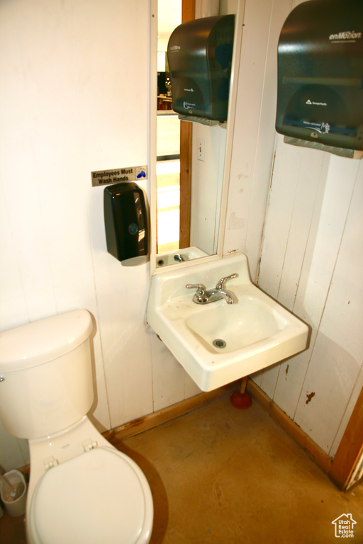 Half bath with a sink and toilet