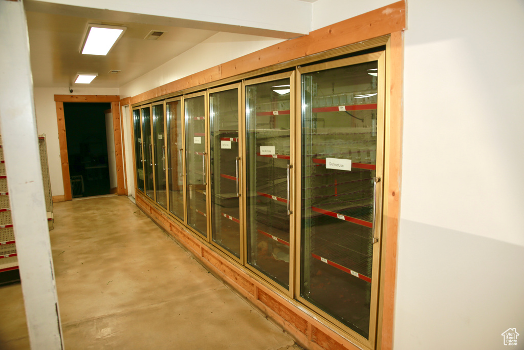 Interior space featuring concrete floors and visible vents