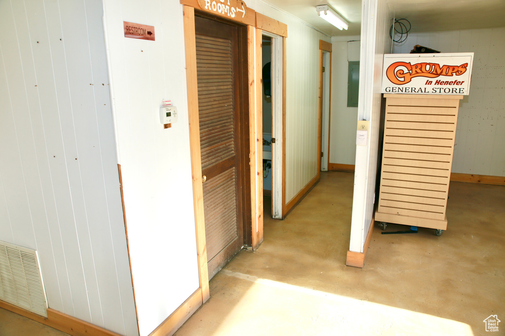 Hall with concrete flooring and visible vents