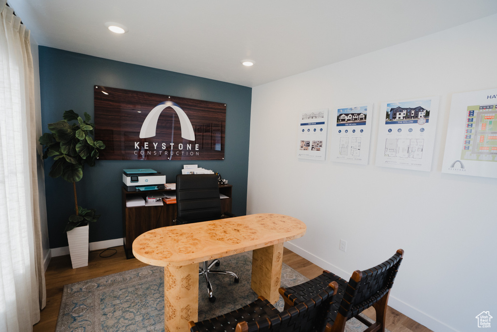 Dining room featuring wood finished floors, baseboards, and recessed lighting