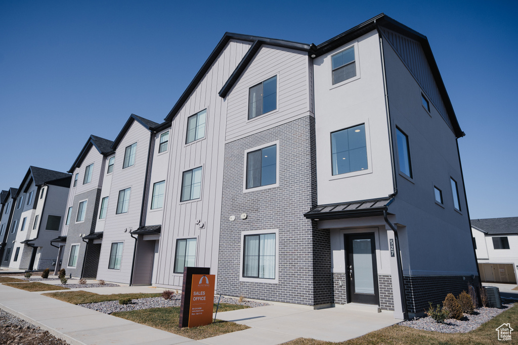 View of property with a residential view