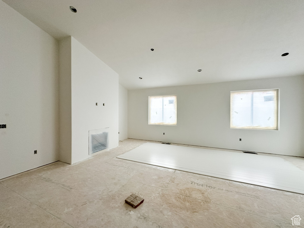 Unfurnished living room featuring visible vents