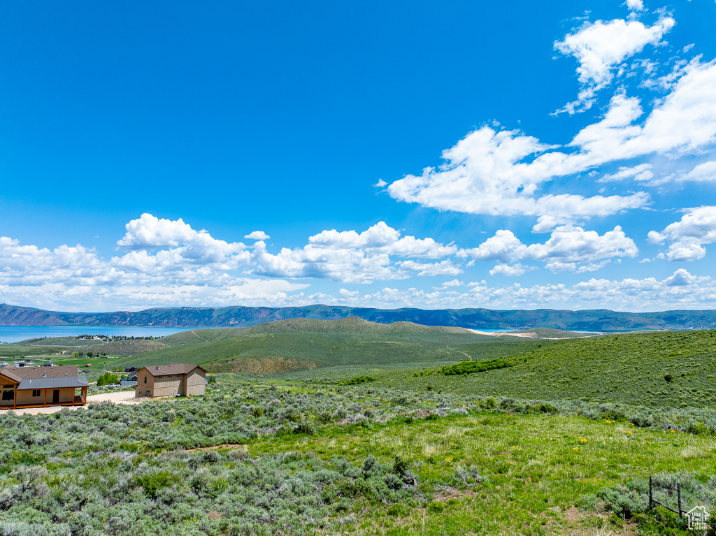 View of mountain backdrop featuring a large body of water
