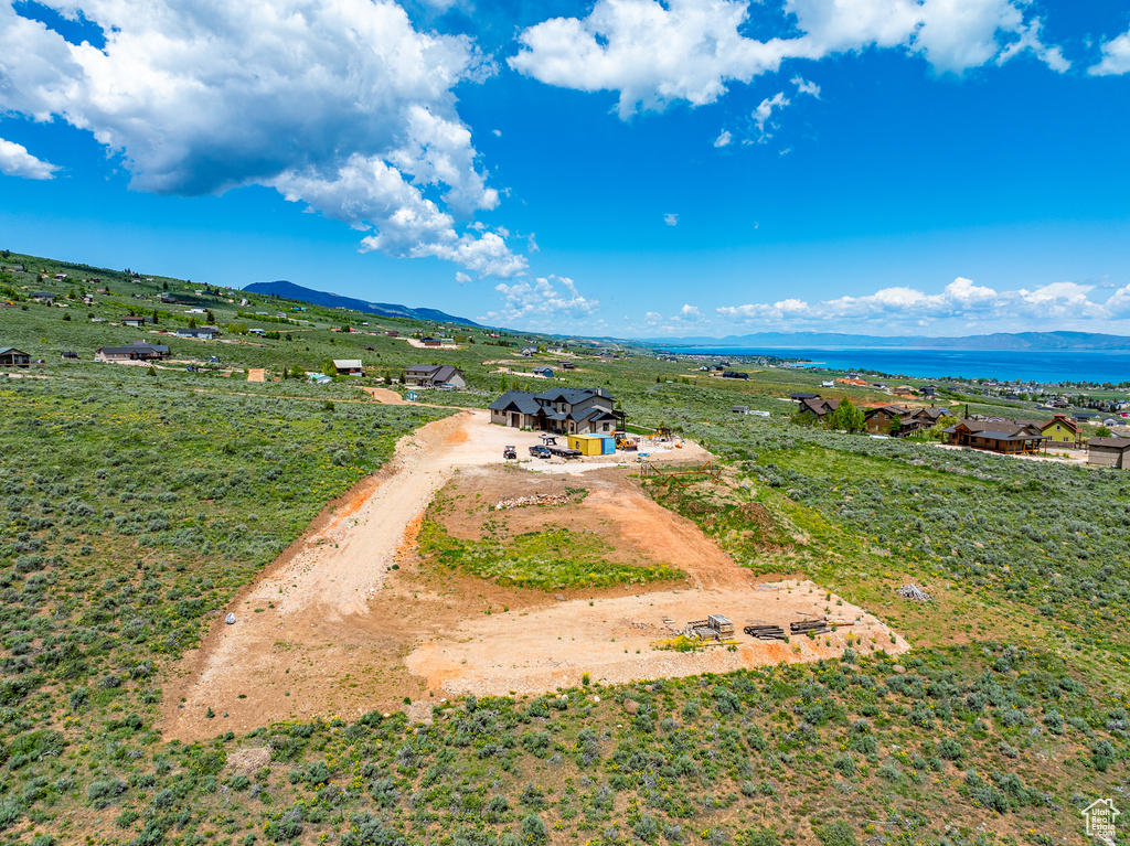 View of subject property featuring a mountainous background