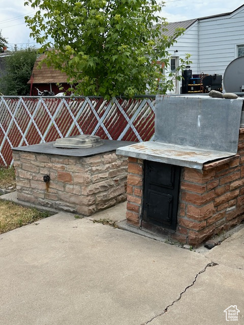 View of patio with exterior kitchen