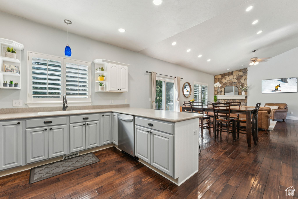 Kitchen featuring open shelves, a ceiling fan, a peninsula, recessed lighting, and lofted ceiling