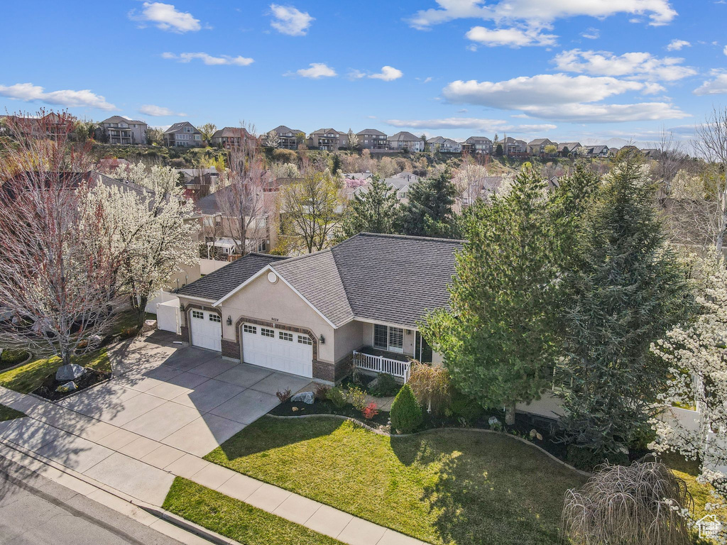 Birds eye view of property with a residential view