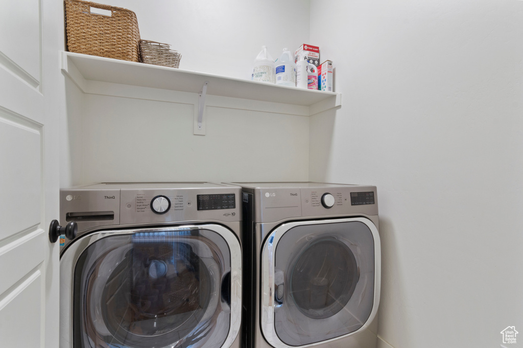 Laundry room with separate washer and dryer and laundry area
