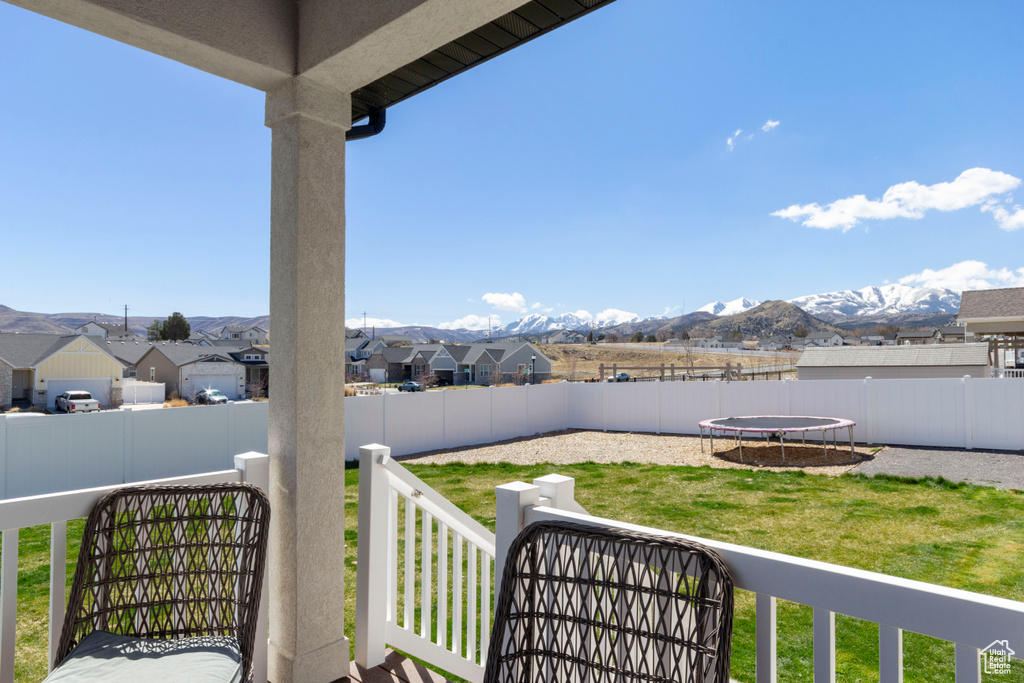 Balcony with a residential view and a mountain view