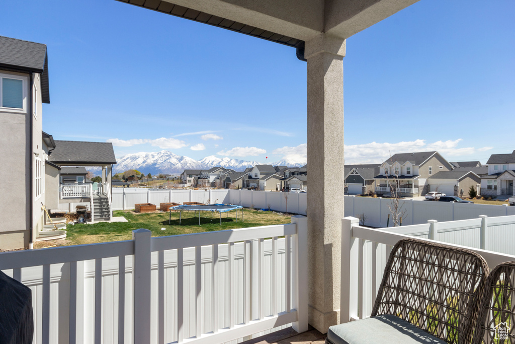 Balcony with a residential view and a mountain view