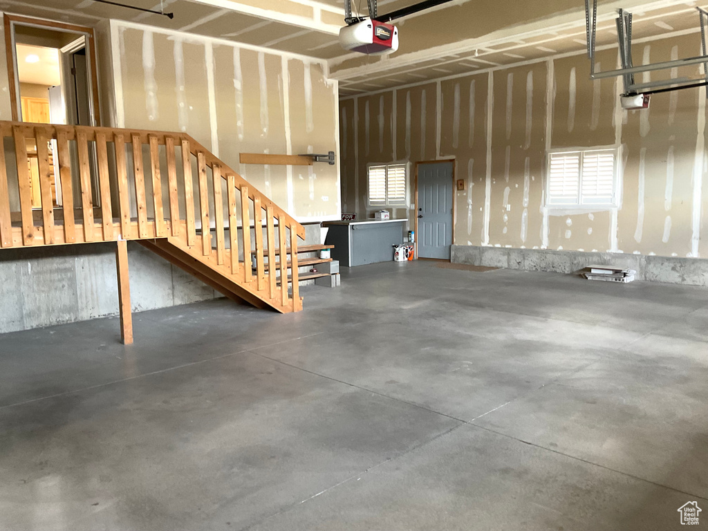 Garage featuring a garage door opener