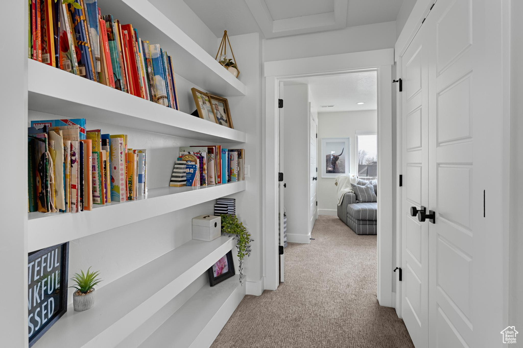 Hall with baseboards and carpet floors