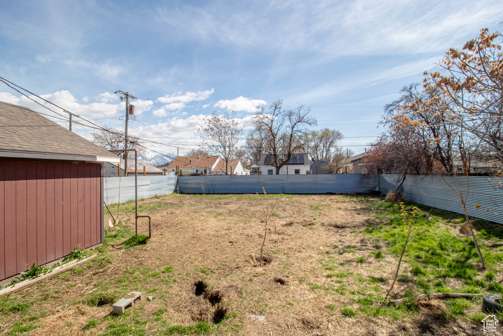 View of yard with a fenced backyard
