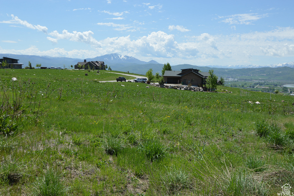 Property view of mountains with a rural view