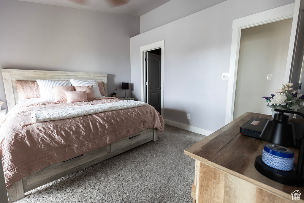 Carpeted bedroom featuring baseboards
