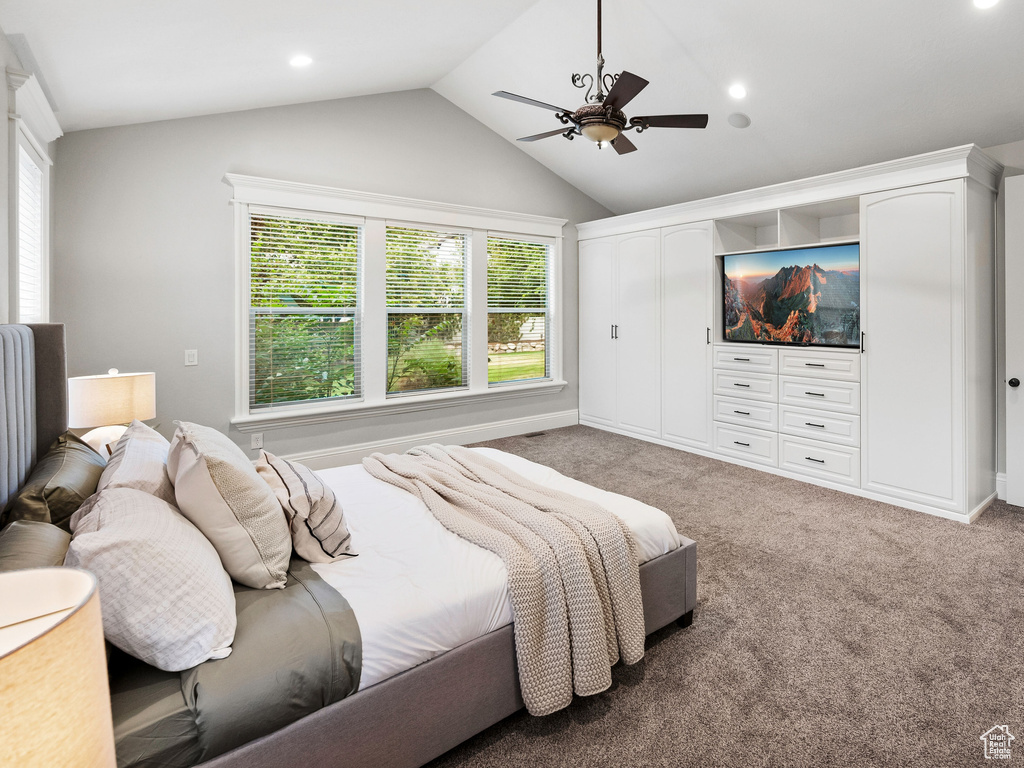 Bedroom featuring lofted ceiling, multiple windows, carpet flooring, a ceiling fan, and recessed lighting