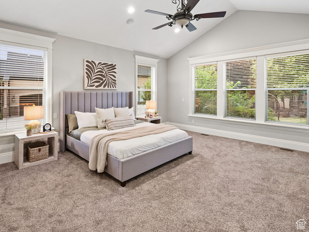 Carpeted bedroom featuring vaulted ceiling, ceiling fan, and recessed lighting