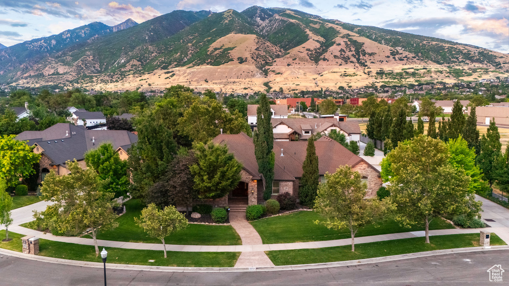 View of mountain backdrop featuring nearby suburban area