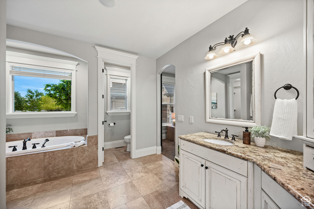 Bathroom with vanity and a garden tub