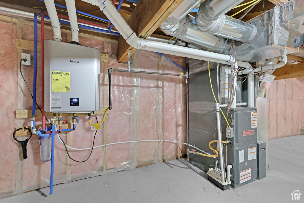 Utility room with tankless water heater and heating unit