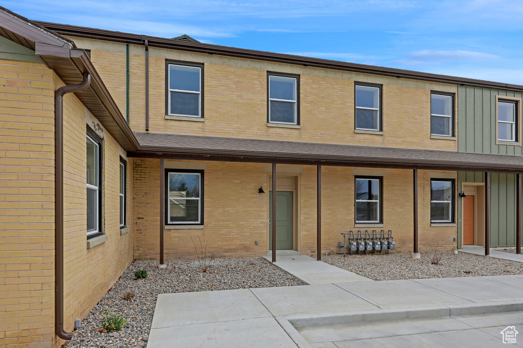 View of property with brick siding