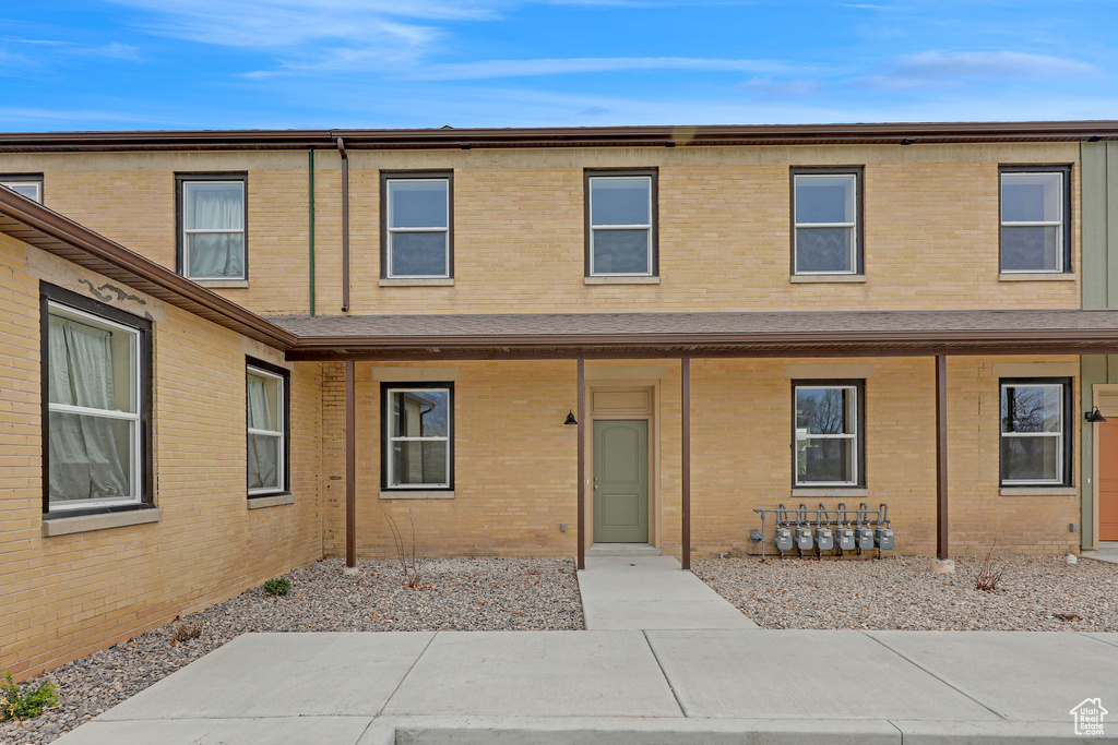 View of front facade featuring brick siding