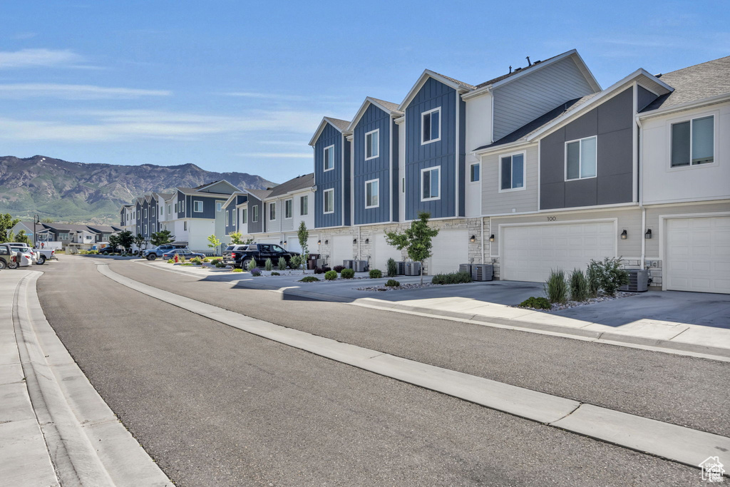 View of road with a residential view, a mountain view, and sidewalks