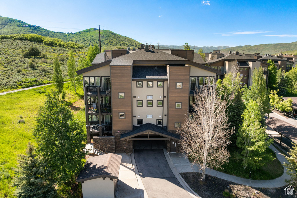 View of property with a mountain view