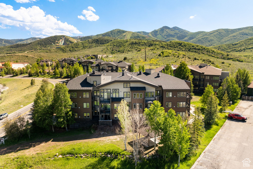 View of mountain backdrop featuring nearby suburban area